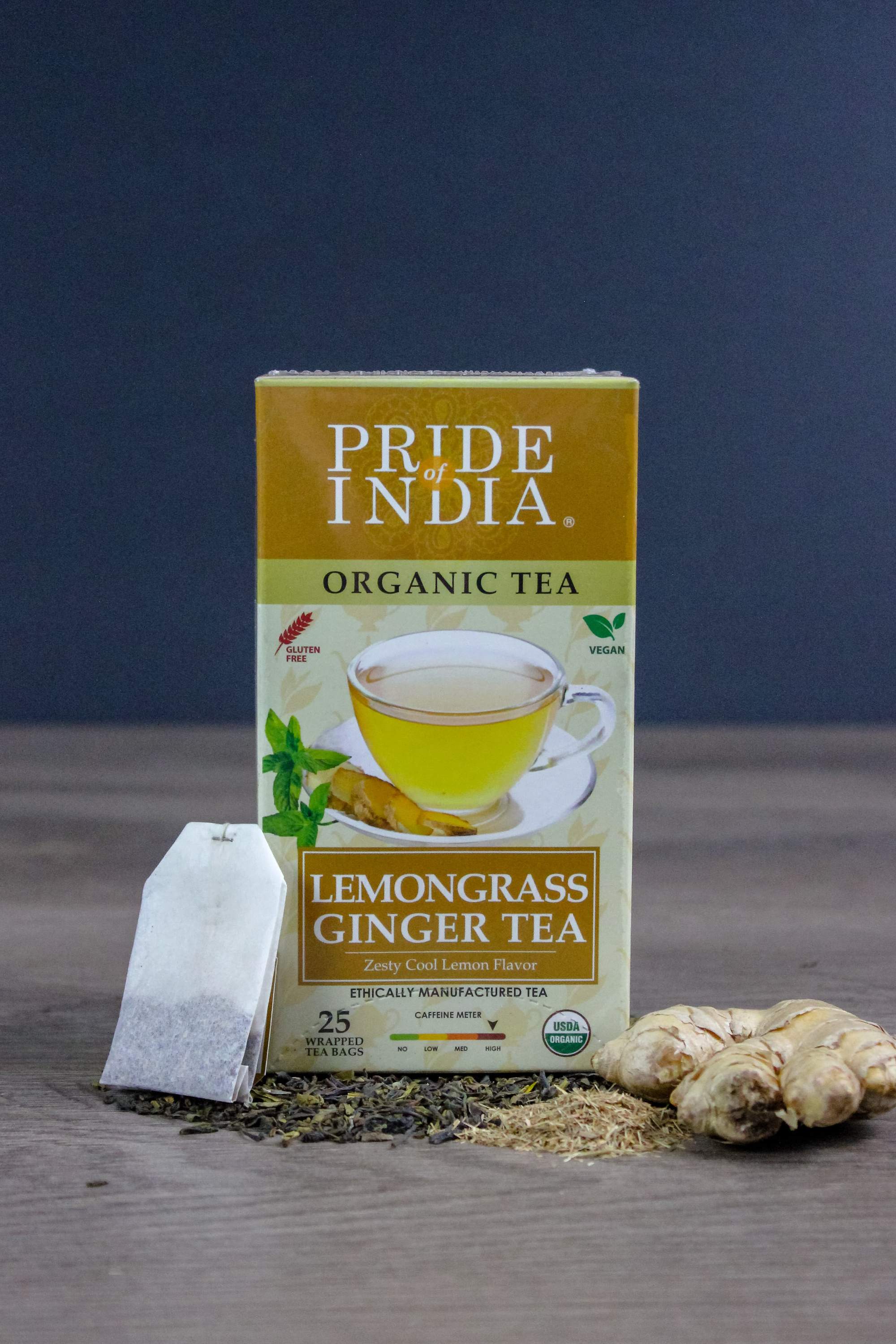 A box of Lemongrass Ginger tea bags featuring organic ingredients, showcasing the vibrant packaging and tea bags inside.