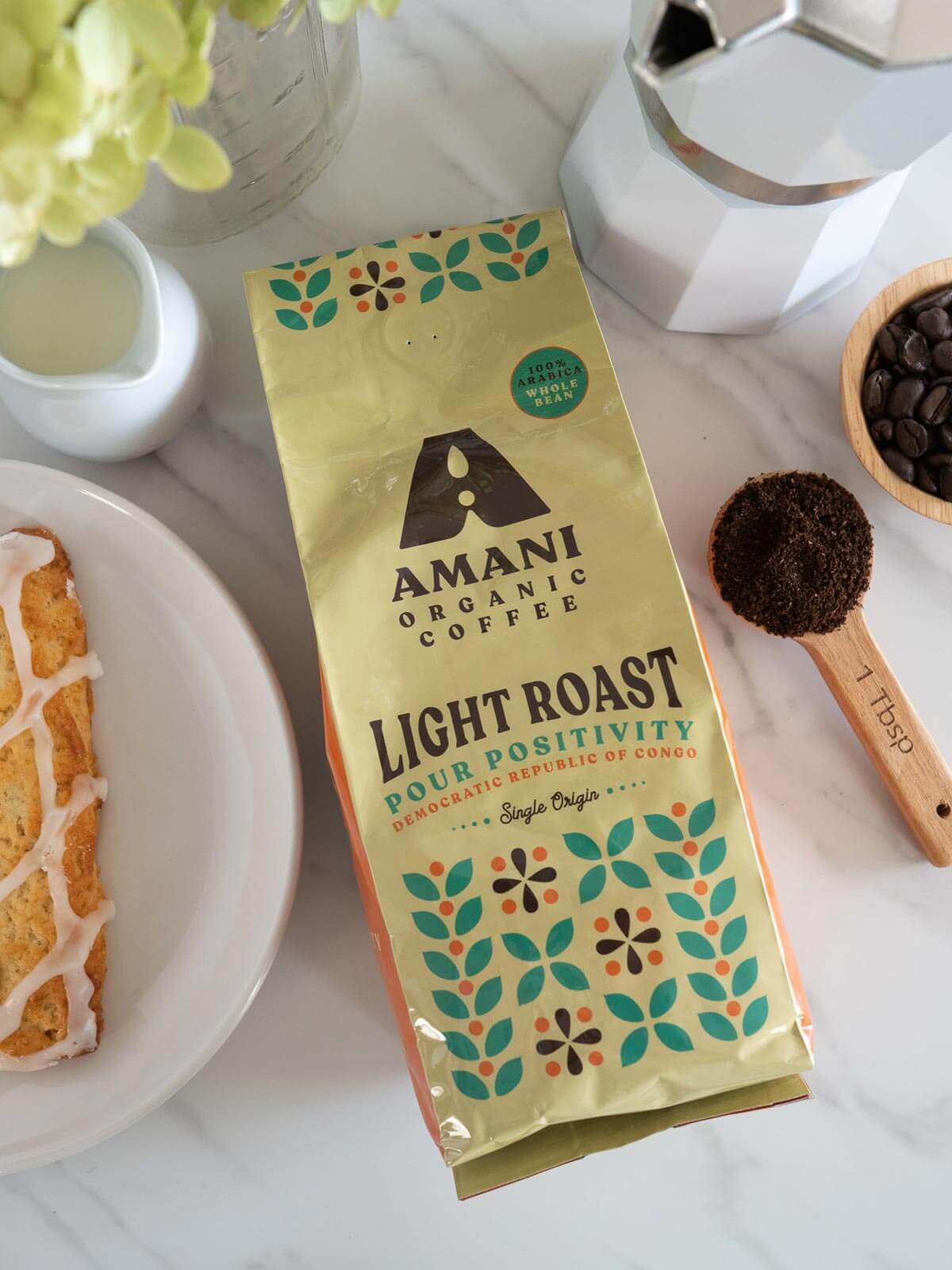 Amani Light Roast Single Origin Organic Coffee beans showcasing their bright and clean appearance, ideal for brewing a refreshing cup.