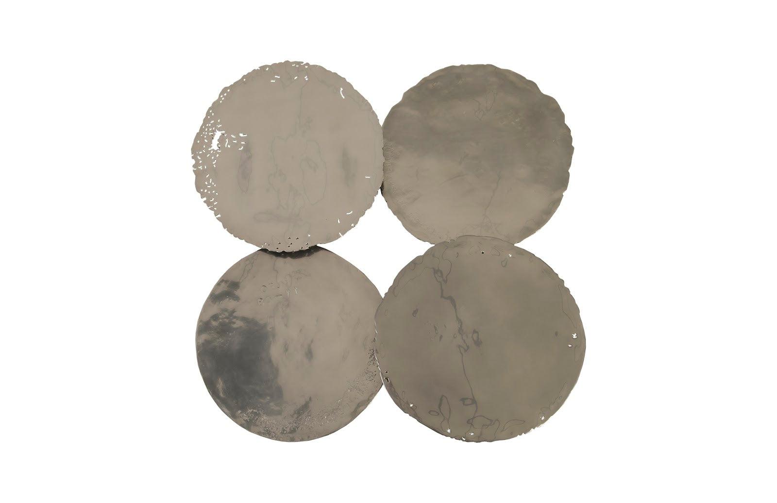 Set of four Liquid Silver Cast Oil Drum Wall Discs, showcasing a rustic design with a liquid silver finish, perfect for modern decor.