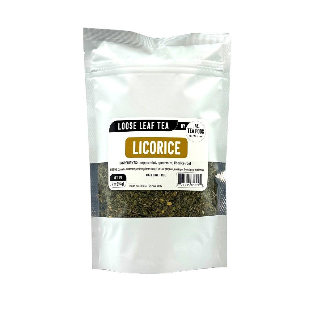 A cup of loose leaf licorice blend tea with peppermint and spearmint leaves, showcasing its vibrant colors and inviting aroma.