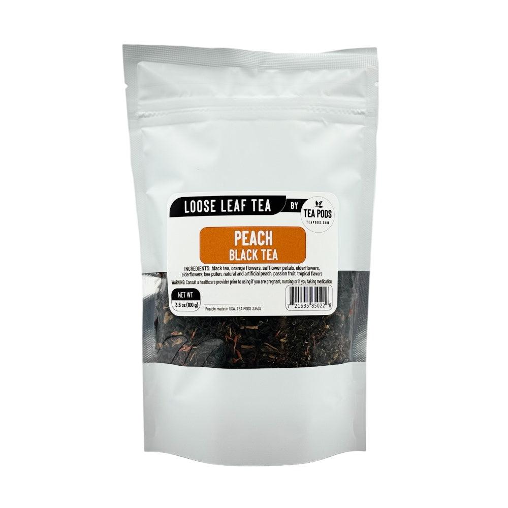 A vibrant display of loose leaf Peach Black Tea with orange flowers and safflower petals, showcasing its fruity and floral blend.