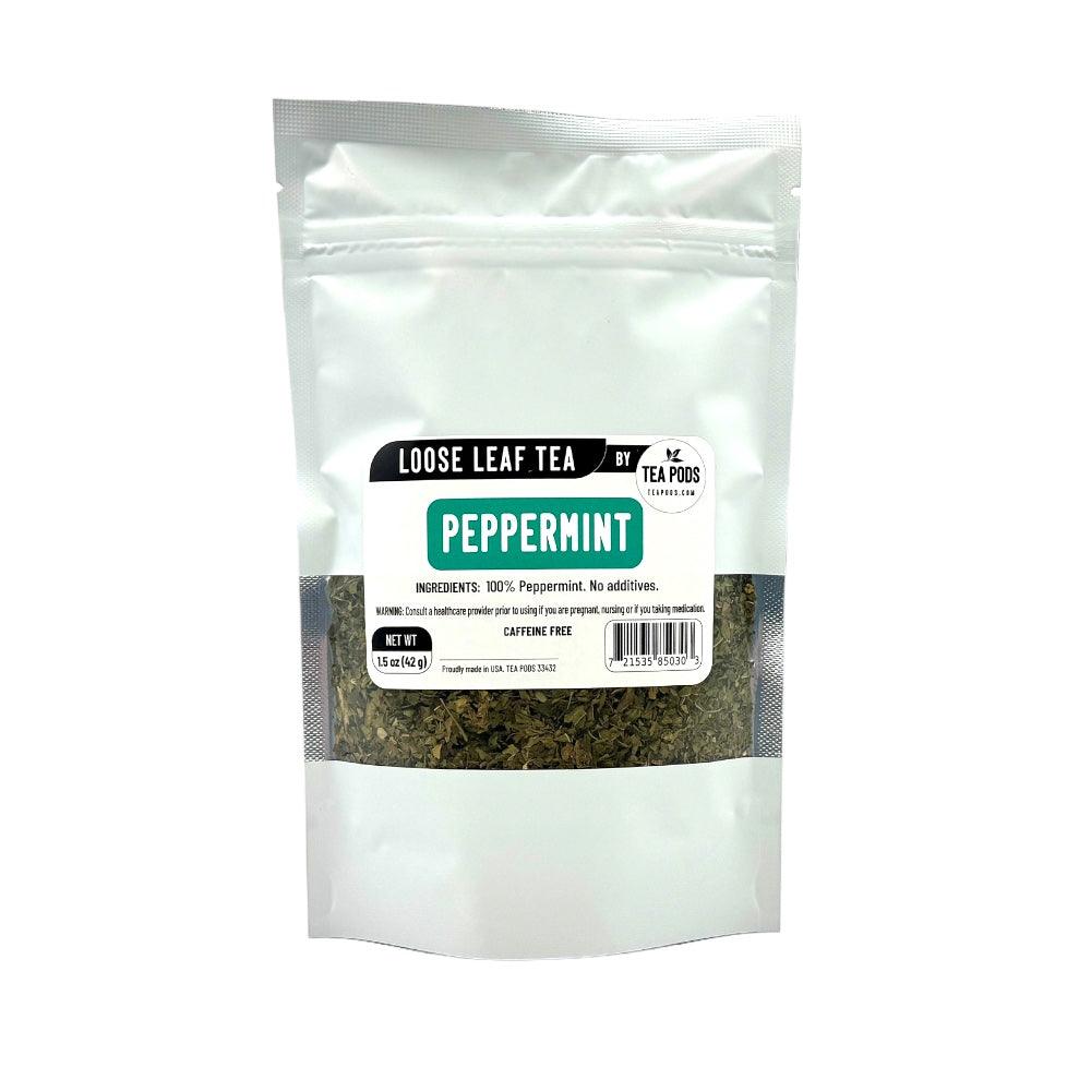 A pack of loose leaf peppermint tea featuring vibrant green leaves, perfect for brewing a refreshing and aromatic beverage.