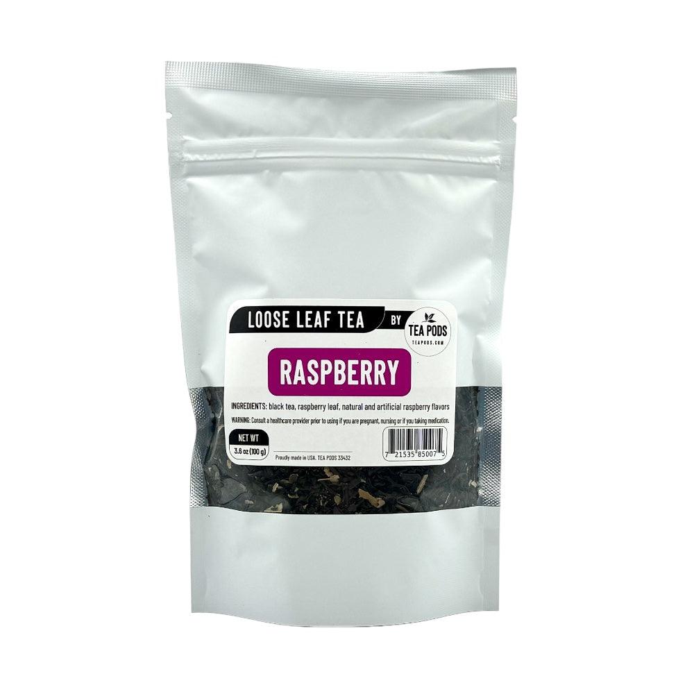 A close-up of Loose Leaf Raspberry Black Tea showcasing black tea leaves mixed with raspberry leaves and vibrant raspberry pieces.