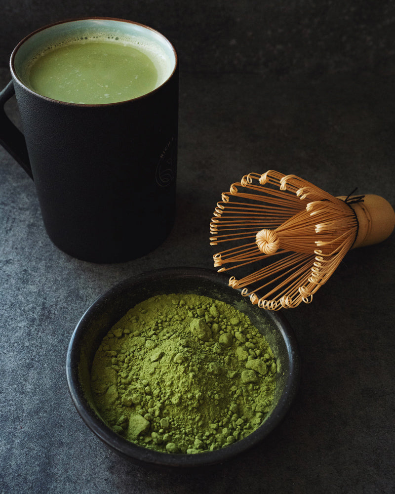 Matcha tea with whisk and powder