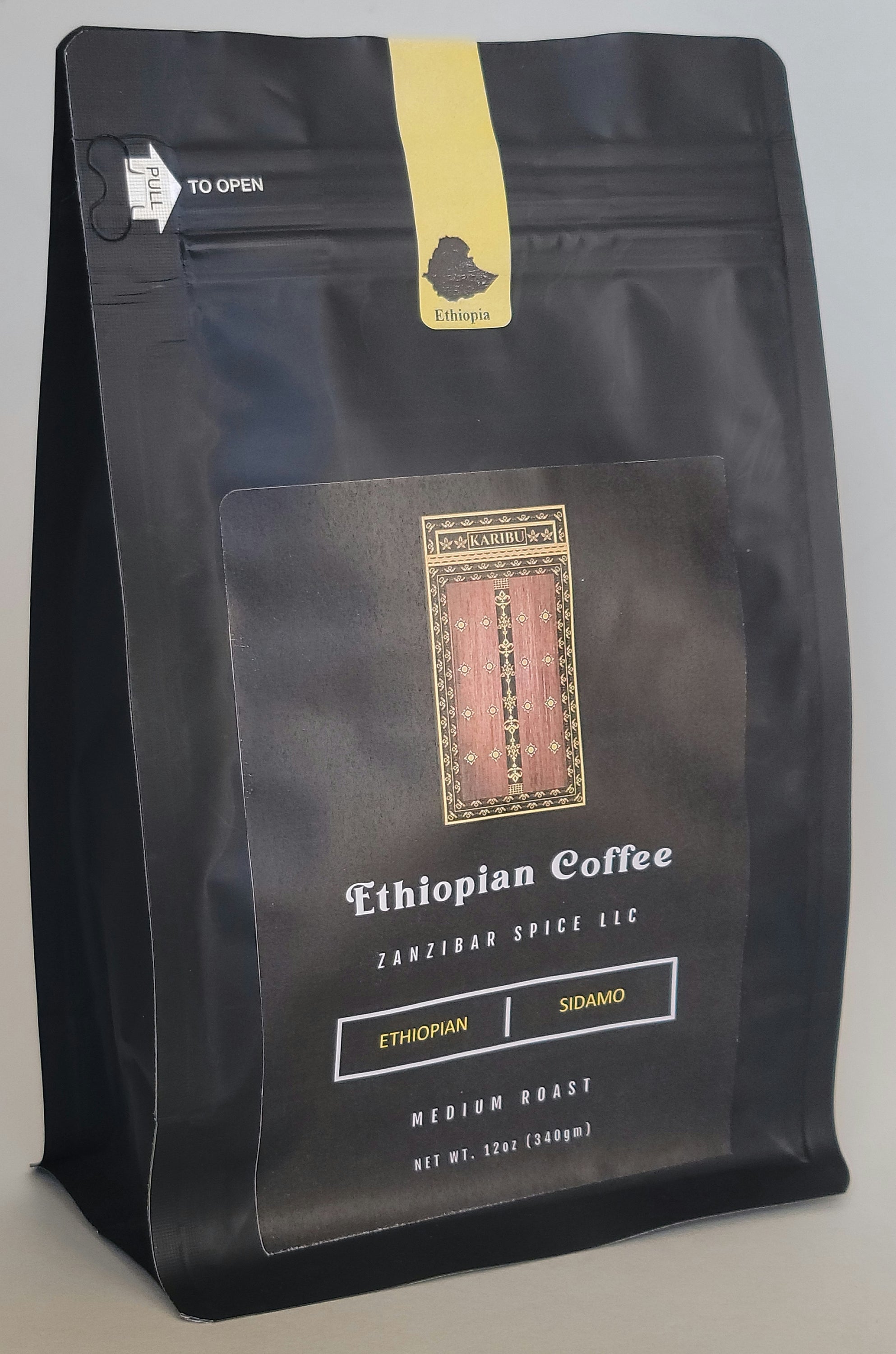 A 12oz resealable bag of Medium Roast Ethiopia Sidamo coffee, showcasing its rich brown color and premium quality.