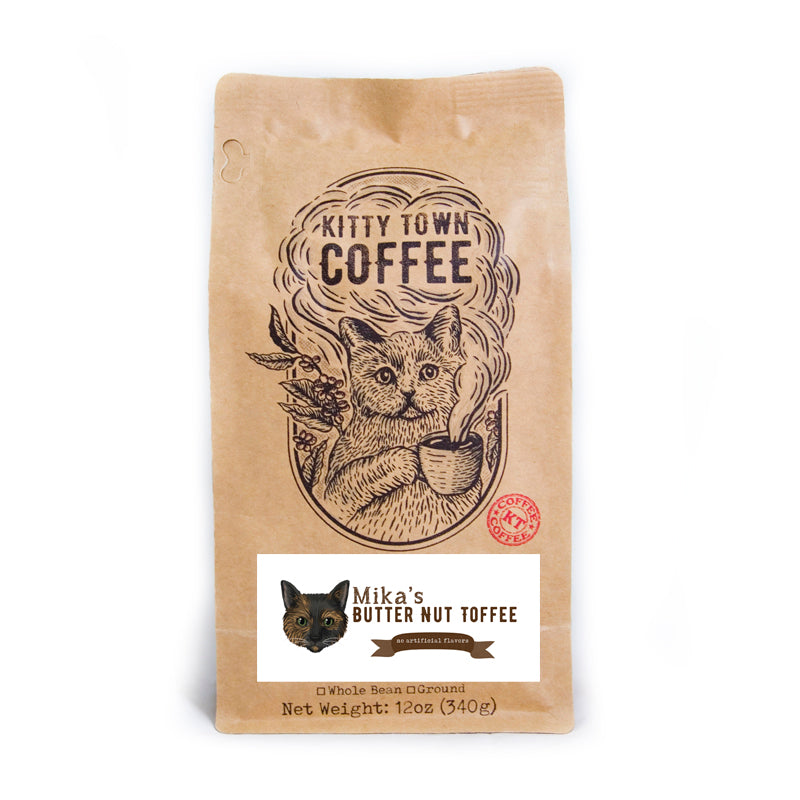 A bag of Mika's Butter Nut Toffee coffee featuring light roast Brazilian beans with a rich toffee flavor.