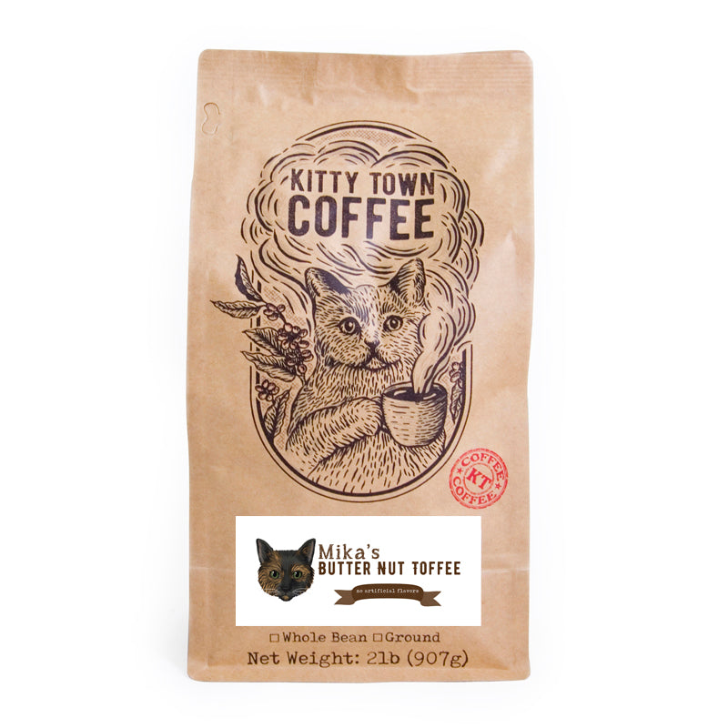 A bag of Mika's Butter Nut Toffee coffee featuring light roast Brazilian beans with a rich toffee flavor.