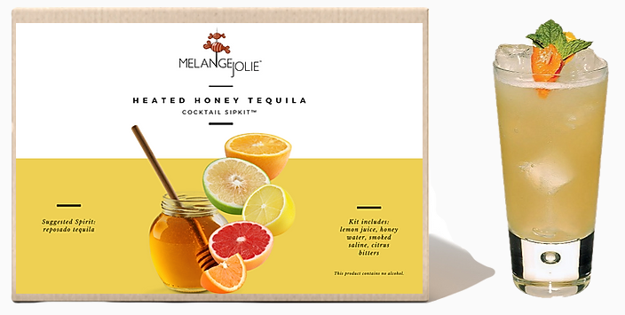 Mélange Jolie Heated Honey Tequila Cocktail SipKit™ with ingredients and accessories displayed in an elegant arrangement.