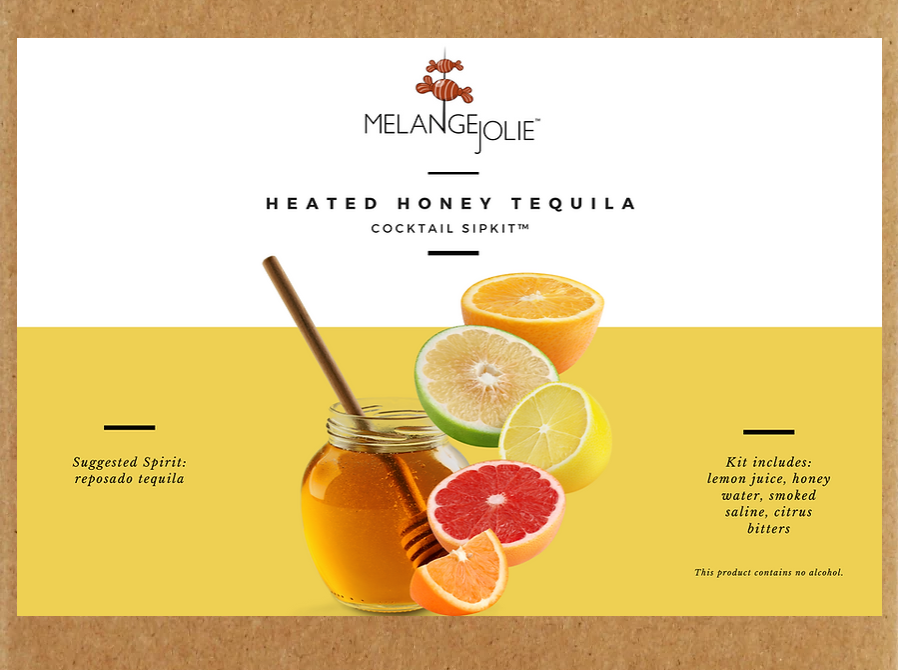 Mélange Jolie Heated Honey Tequila Cocktail SipKit™ with ingredients and accessories displayed in an elegant arrangement.