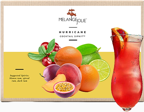 Mélange Jolie Hurricane Cocktail SipKit™ featuring a hurricane glass, bar tools, and homemade organic syrups with dehydrated fruits.