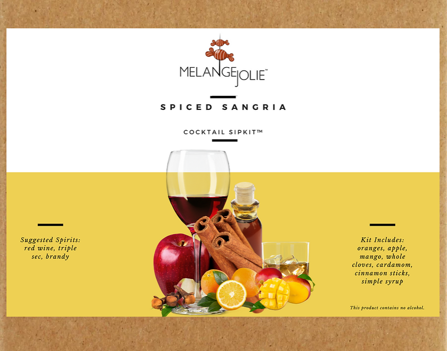 Mélange Jolie Spiced Sangria Cocktail SipKit™ with metal tumbler, dehydrated fruits, and spices displayed elegantly.