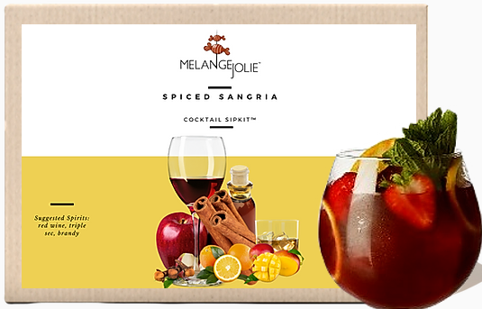 Mélange Jolie Spiced Sangria Cocktail SipKit™ with metal tumbler, dehydrated fruits, and spices displayed elegantly.