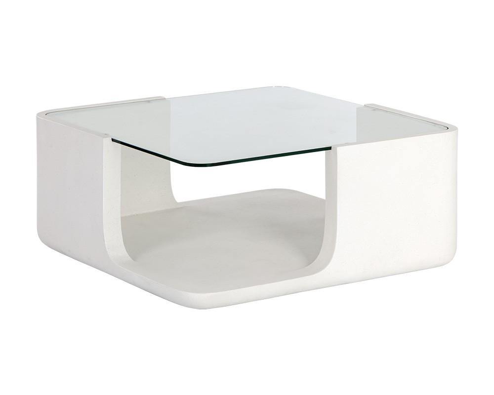 Odis Coffee Table featuring a white concrete base and clear glass top, showcasing its modern design and unique texture.