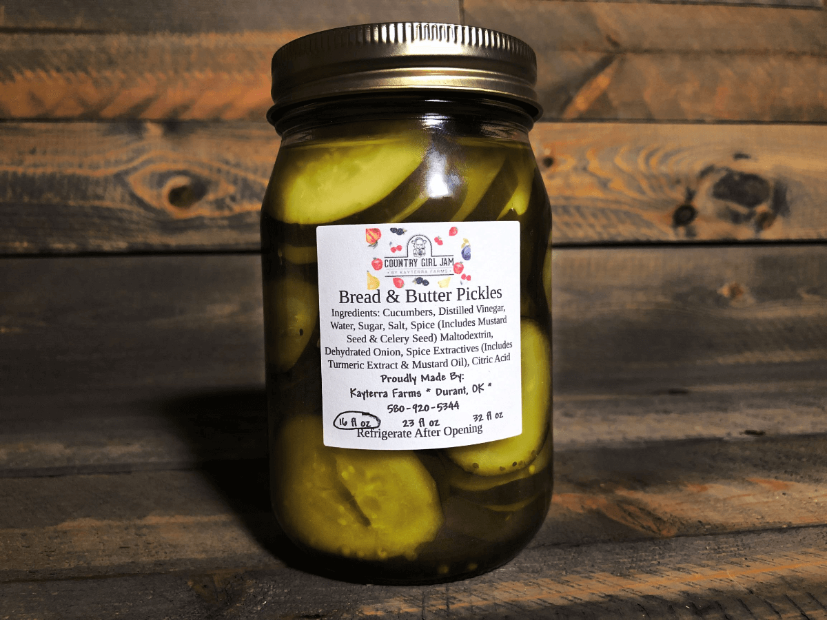 A jar of Old Fashioned Bread & Butter Pickles showcasing their vibrant color and crunchy texture, perfect for sandwiches and snacks.