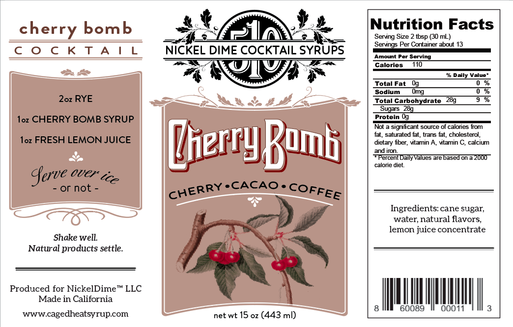 One Case Cherry Bomb cocktail syrup in glass bottles, showcasing rich cherry, cacao, and coffee blend.