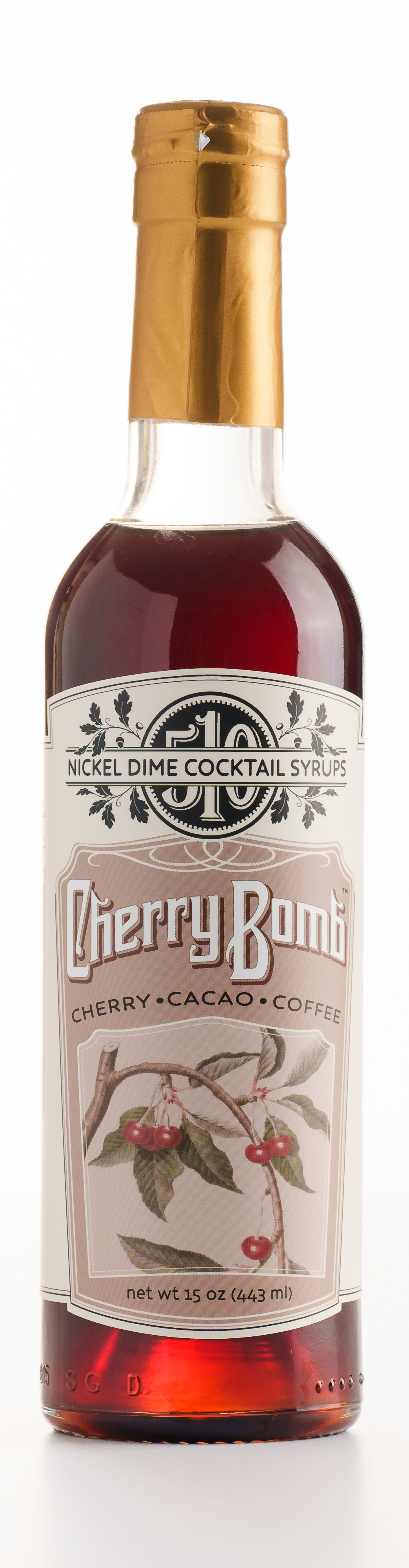 One Case Cherry Bomb cocktail syrup in glass bottles, showcasing rich cherry, cacao, and coffee blend.