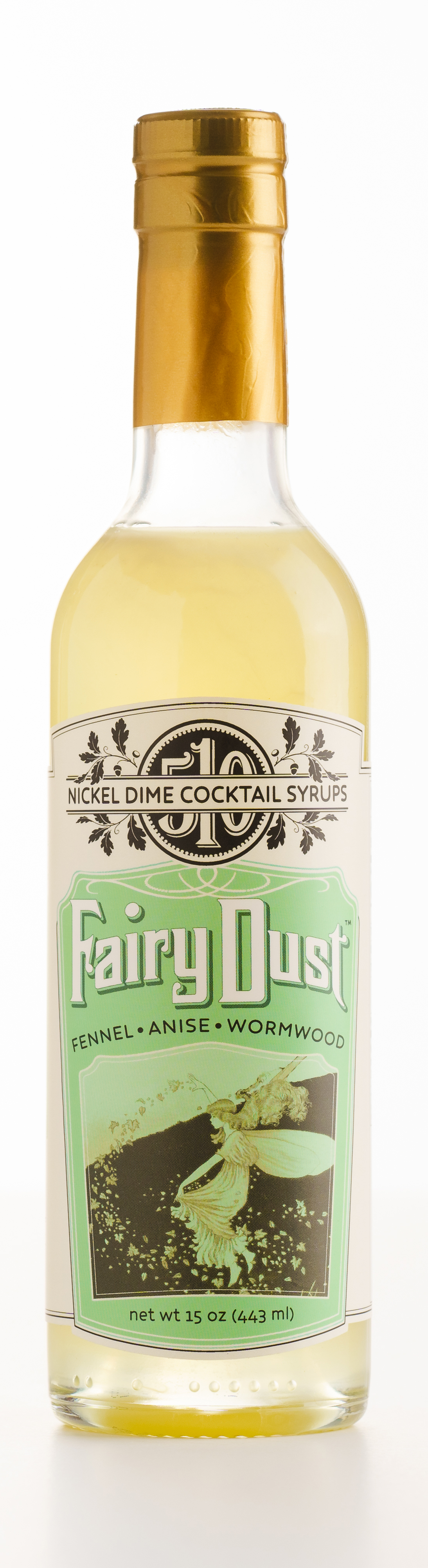 One Case Fairy Dust cocktail syrup featuring fennel, anise, and wormwood in elegant glass bottles.