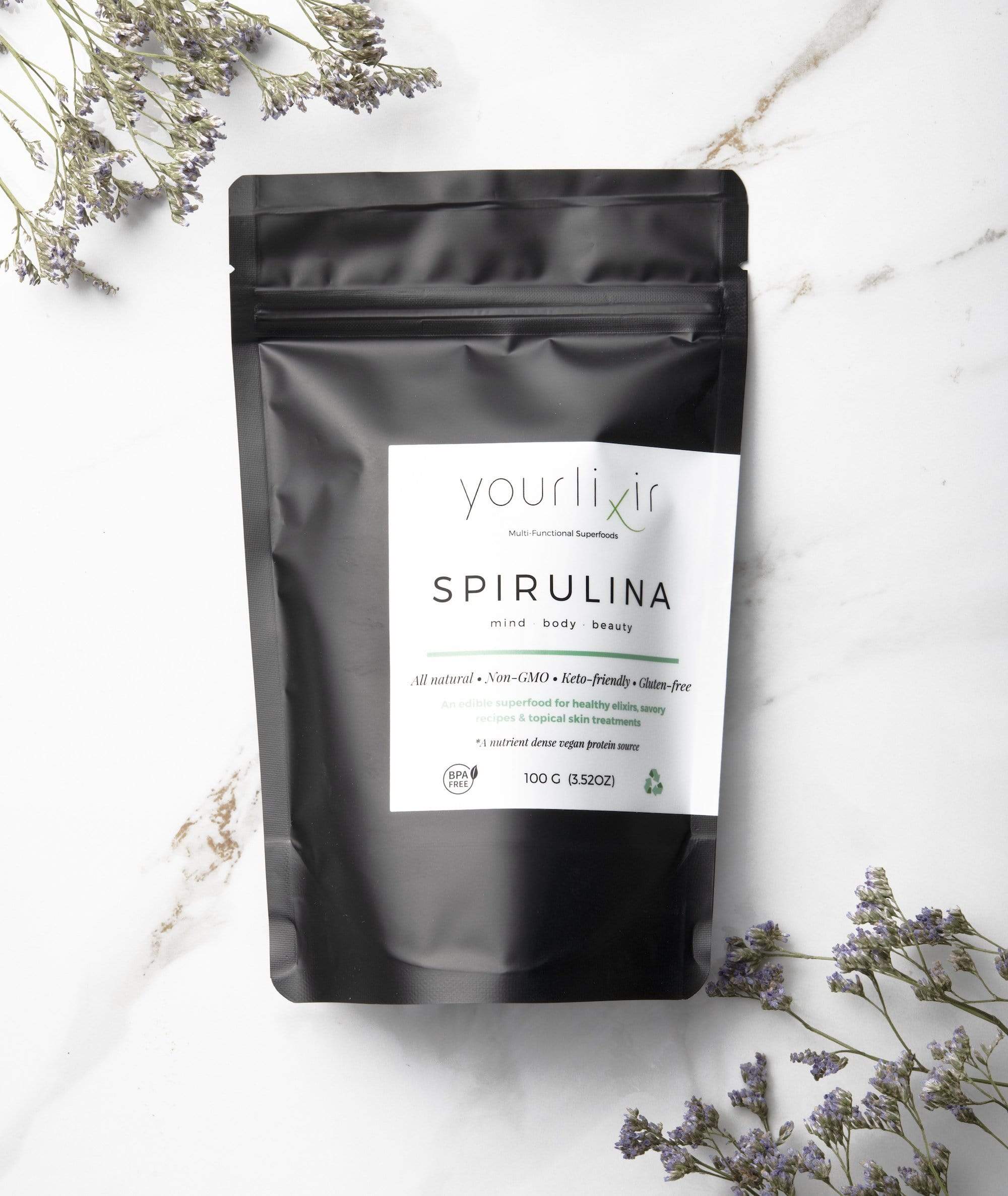 A vibrant green powder of organic spirulina in a bowl, showcasing its rich color and texture, ideal for beauty and wellness applications.