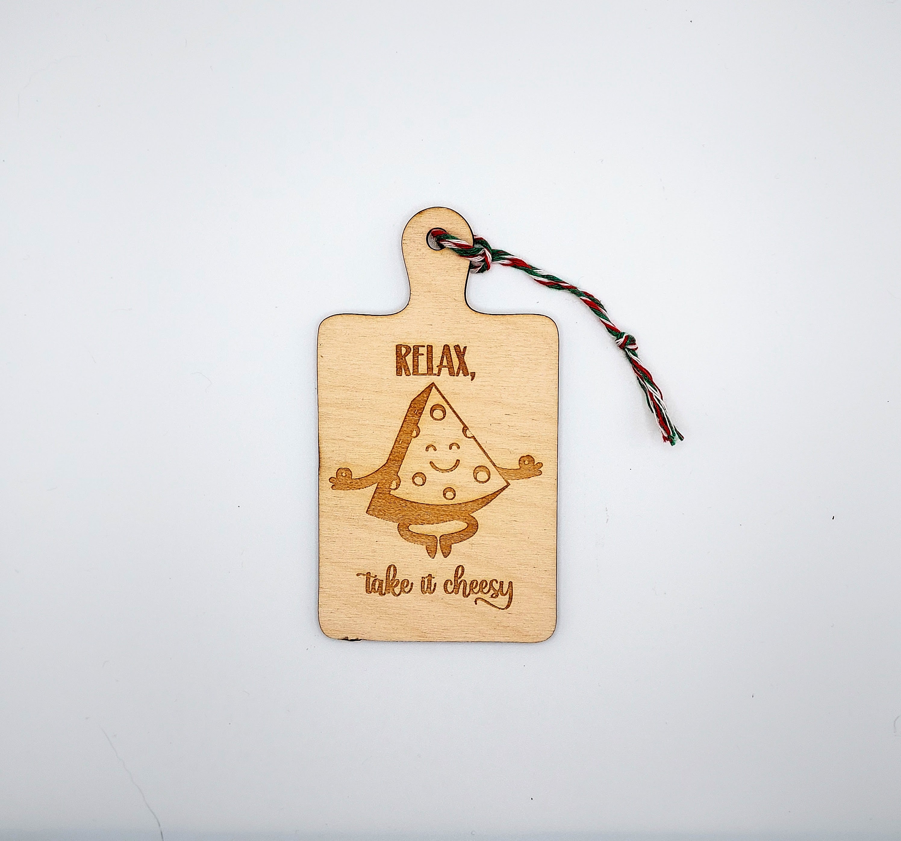 A charming wooden ornament featuring whimsical cheese-themed quotes, perfect for home decor.