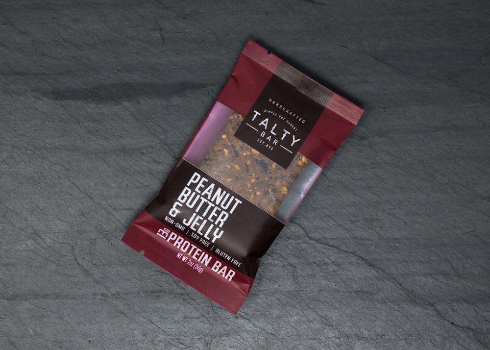 Peanut Butter & Jelly Box energy bar with wholesome ingredients like roasted peanuts and cherries, perfect for on-the-go snacking.