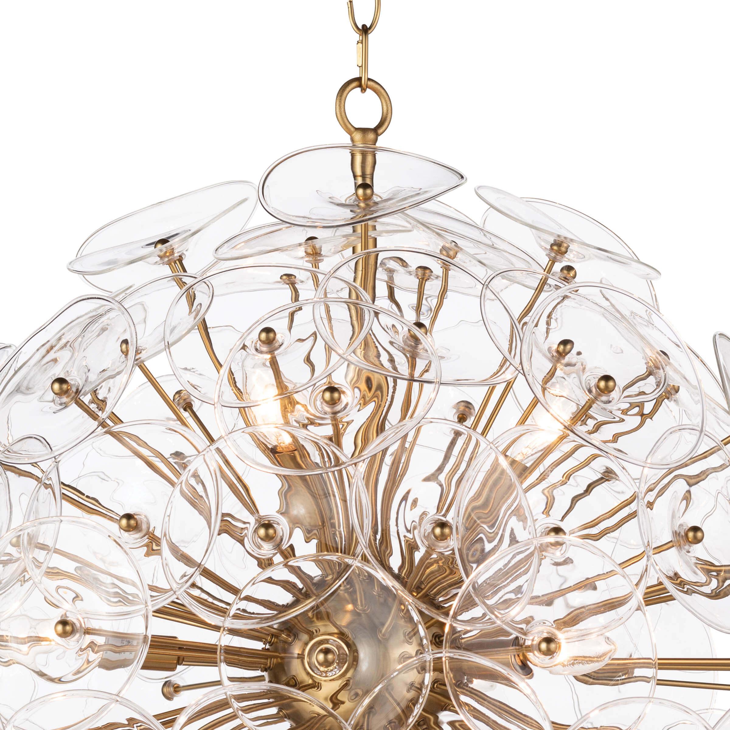 Poppy Glass Chandelier Small featuring clear glass discs and natural brass rods, perfect for modern decor.