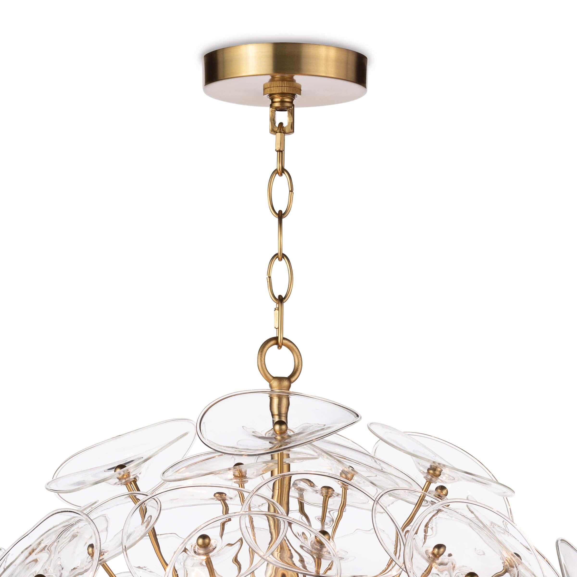 Poppy Glass Chandelier Small featuring clear glass discs and natural brass rods, perfect for modern decor.