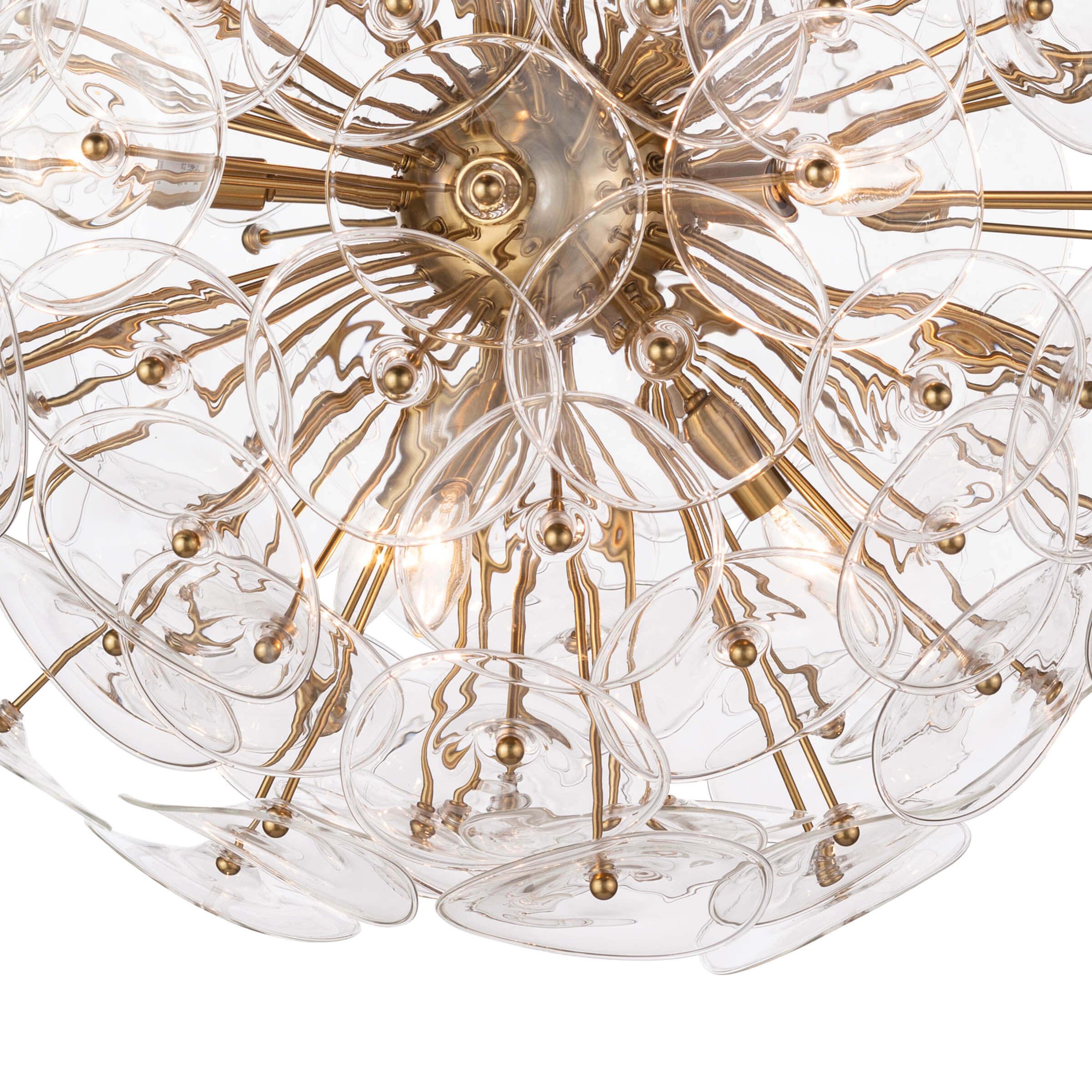 Poppy Glass Chandelier Small featuring clear glass discs and natural brass rods, perfect for modern decor.