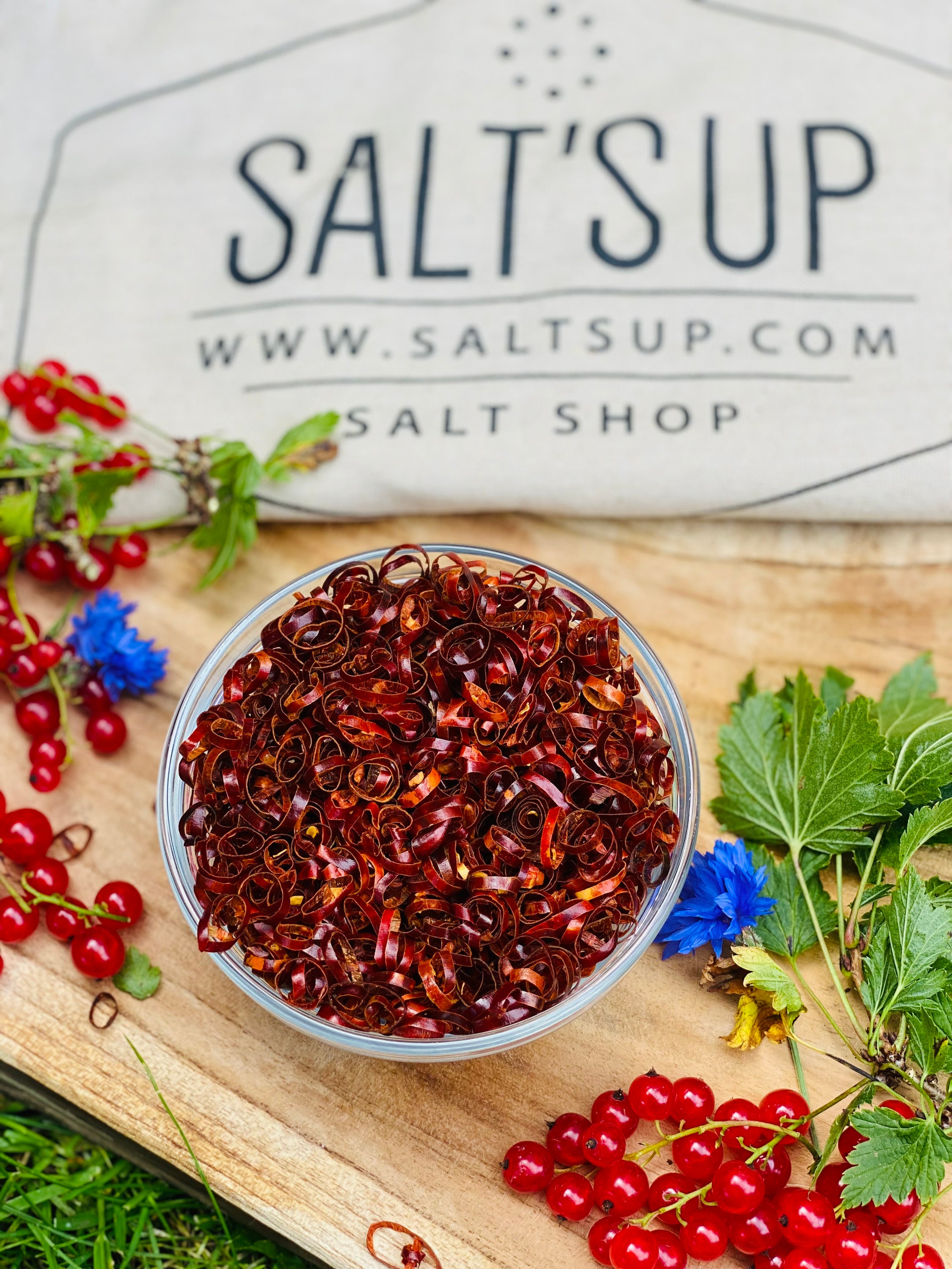 A jar of Red Chili Rings showcasing vibrant red dried chili pepper circles, perfect for cooking and garnishing.