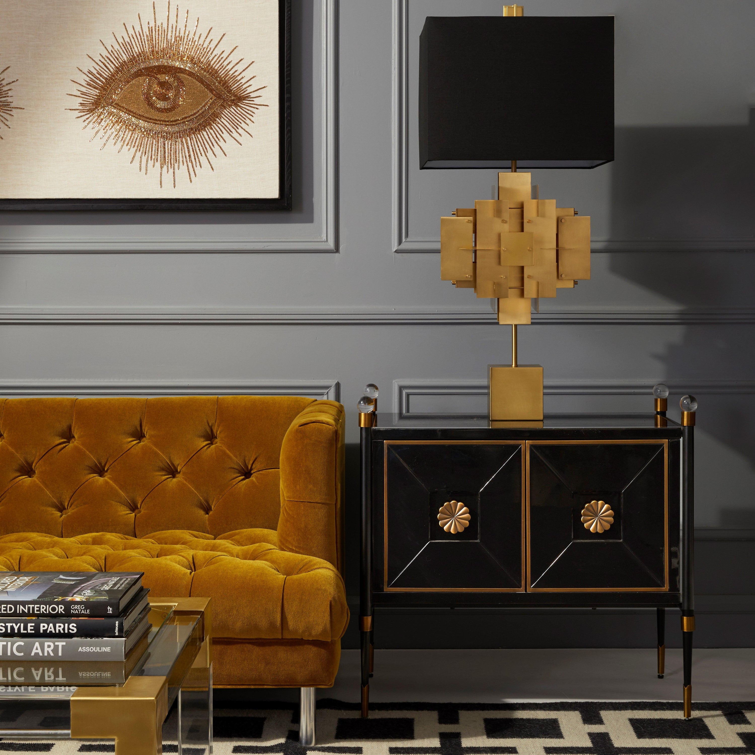 Rider Small Cabinet by Jonathan Adler featuring glossy black lacquer, antiqued brass accents, and acrylic finials, showcasing modern elegance.