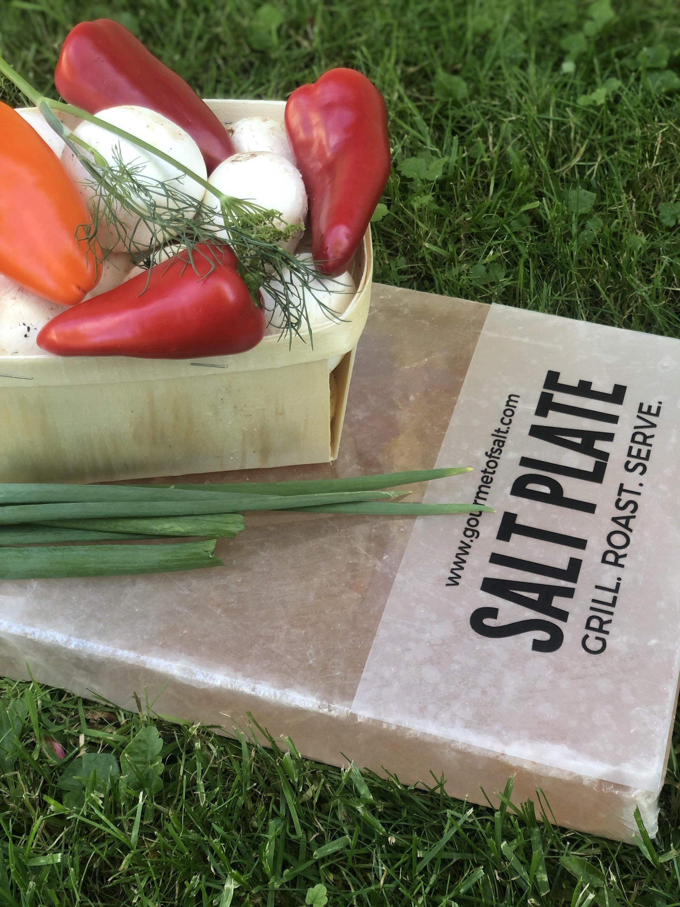 XL Salt Plate made from Himalayan pink salt, perfect for grilling and serving various dishes, showcasing unique natural patterns.