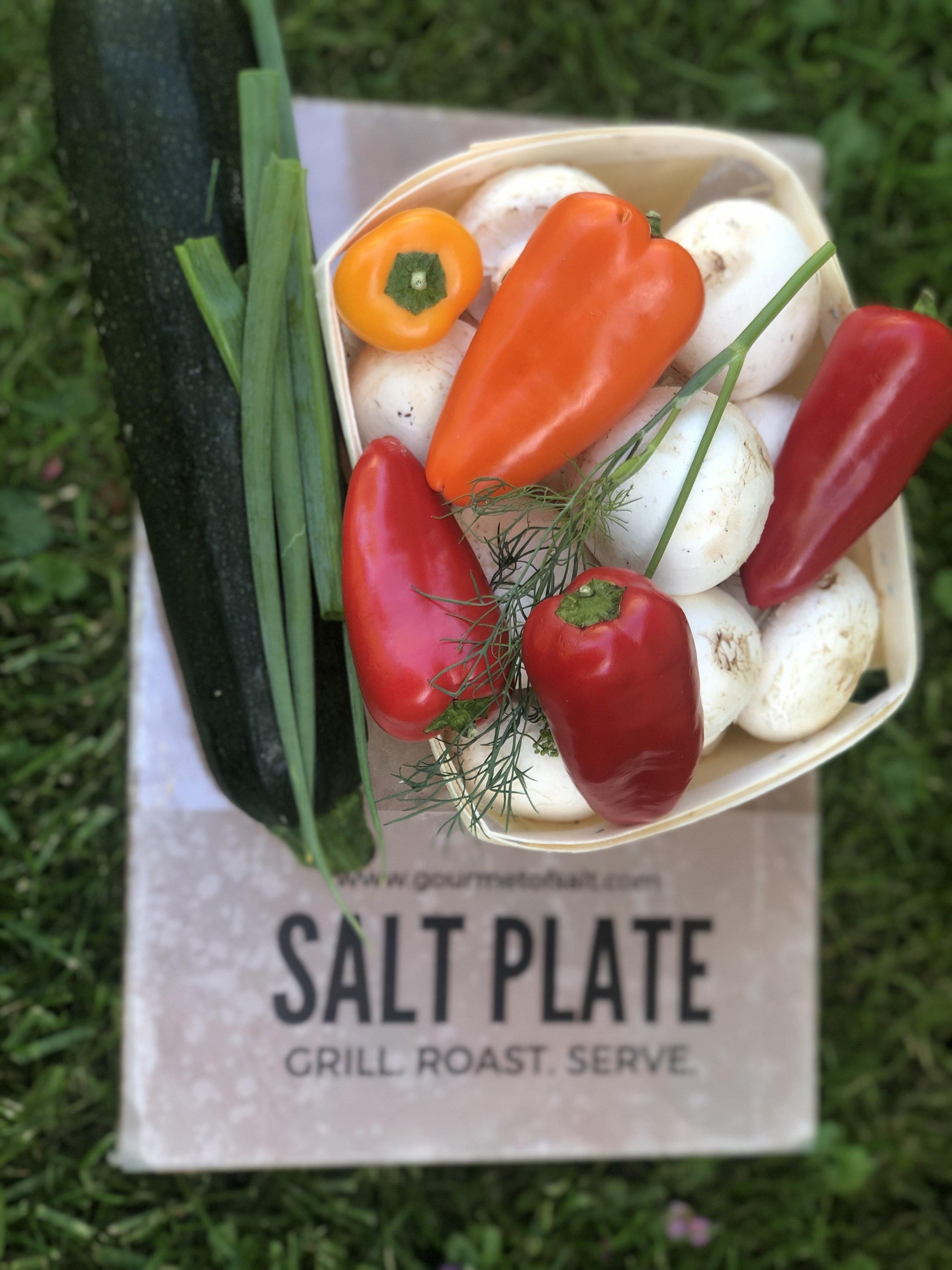 XL Salt Plate made from Himalayan pink salt, perfect for grilling and serving various dishes, showcasing unique natural patterns.