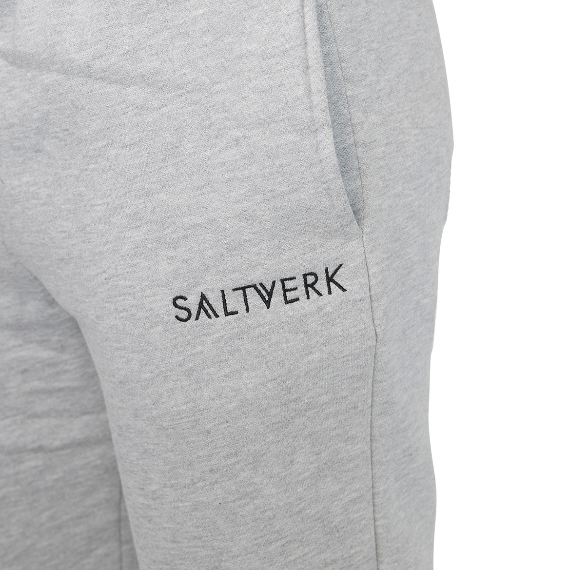 SALTVERK Grey Sweatpants featuring an embroidered logo, made from 100% cotton, showcasing a stylish and comfortable design.