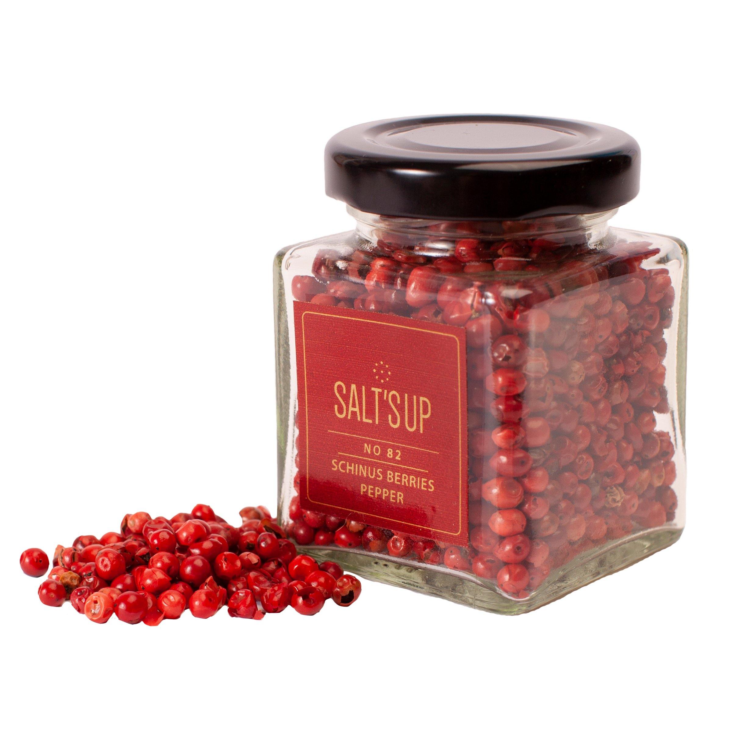 A glass jar containing SCHINUSBERRIES pepper, showcasing its vibrant pink berries, perfect for culinary use.