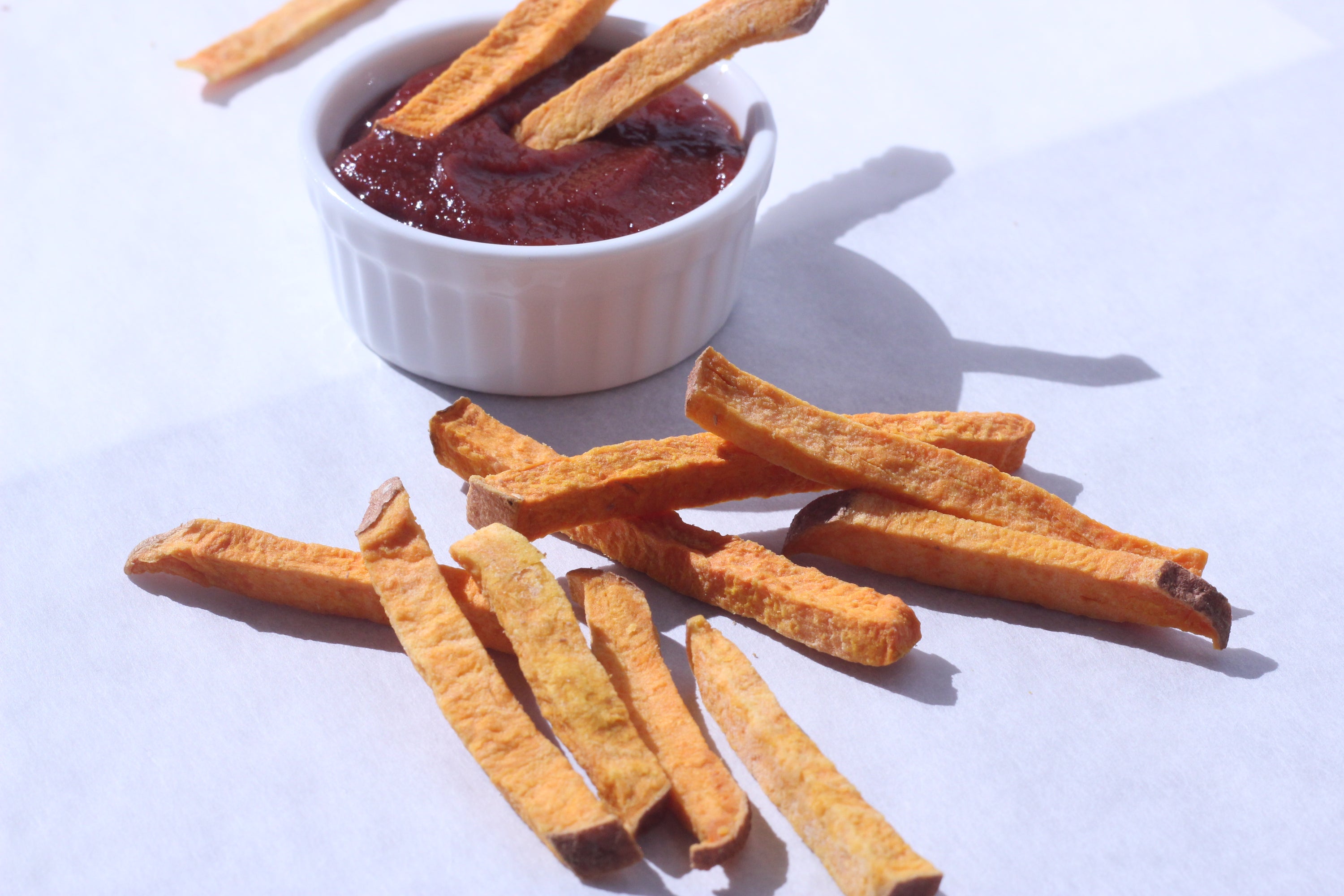 A close-up of crunchy Sea Salt Fries made from organic sweets, showcasing their thick texture and golden color.