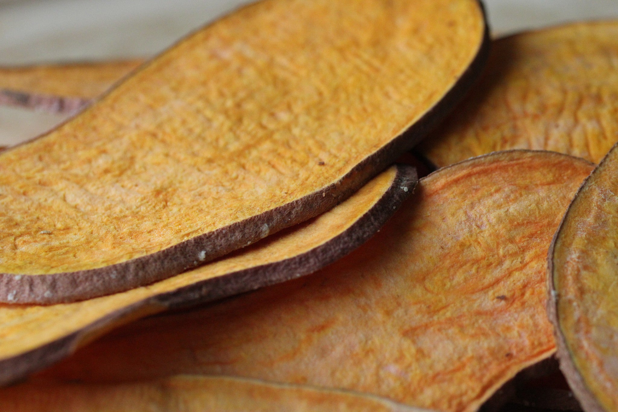 A pack of Sea Salt sweetpotato slices featuring freeze-dried organic sweetpotato seasoned with sea salt and coconut oil.