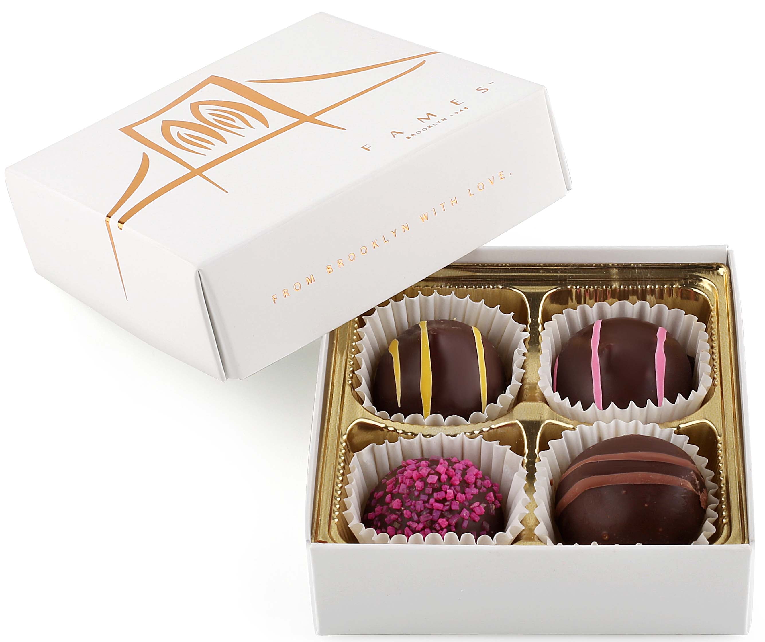 A beautifully arranged small chocolate gift box containing four premium dairy-free chocolates, showcasing unique flavors and textures.