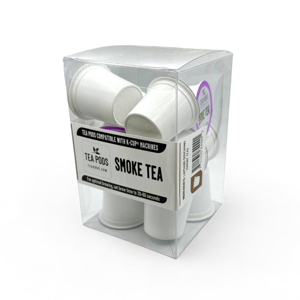 A pack of Smoke tea capsules compatible with K-Cup machines, featuring Lapsang Souchong tea for a rich, smoky flavor.