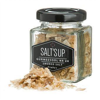 A jar of Smoked Salt 'BEECH' flakes showcasing its coarse texture and rich color, perfect for enhancing various dishes.