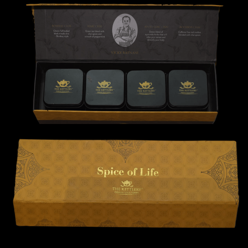 Spice of Life Tea Set featuring four unique spiced chai tea tins in a vibrant yellow box, perfect for gifting.