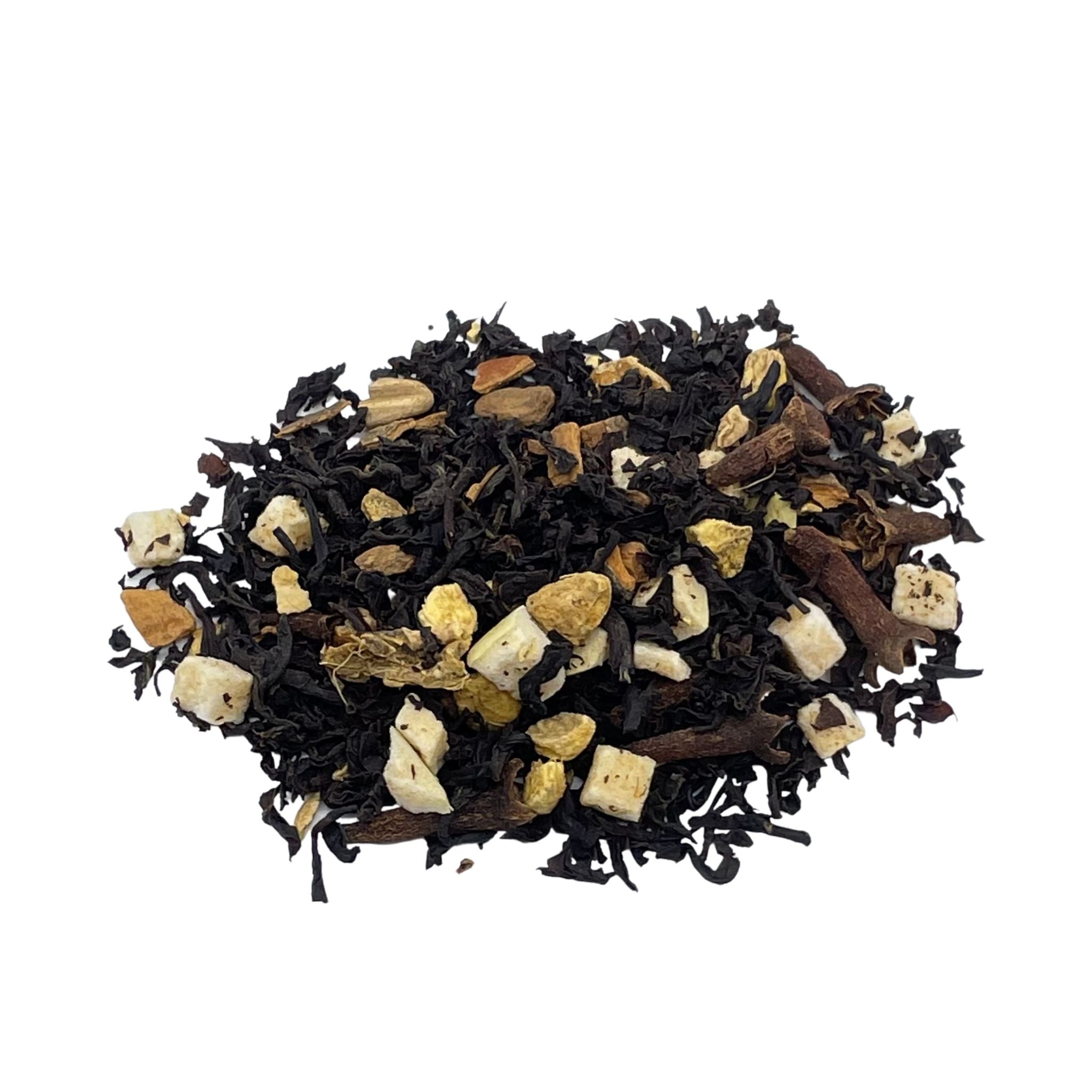 A vibrant display of Spiced Apple Chai loose leaf tea with spices and dried apple pieces, showcasing its rich colors and textures.