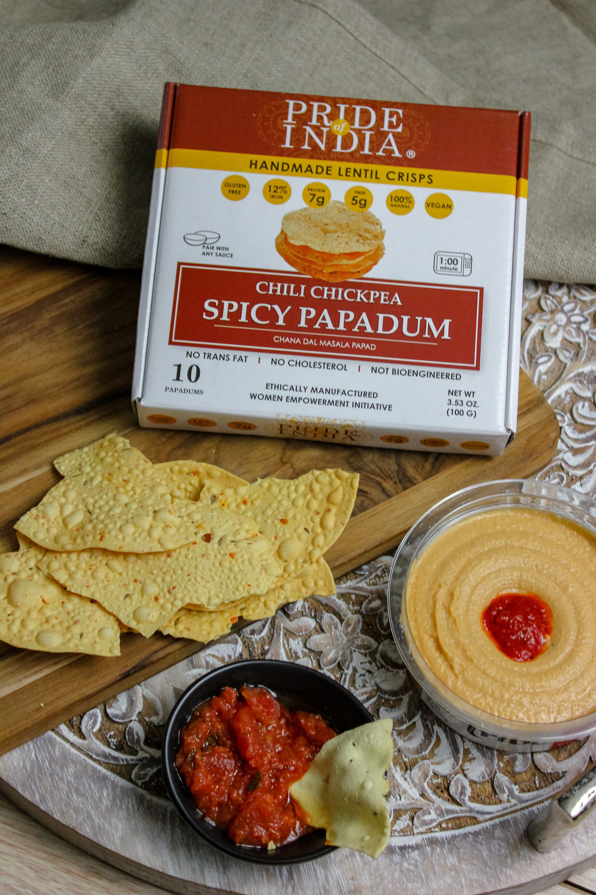 A pack of Spicy Chickpea Masala Papadum Lentil Crisp showcasing the crispy lentil snacks with vibrant spices.