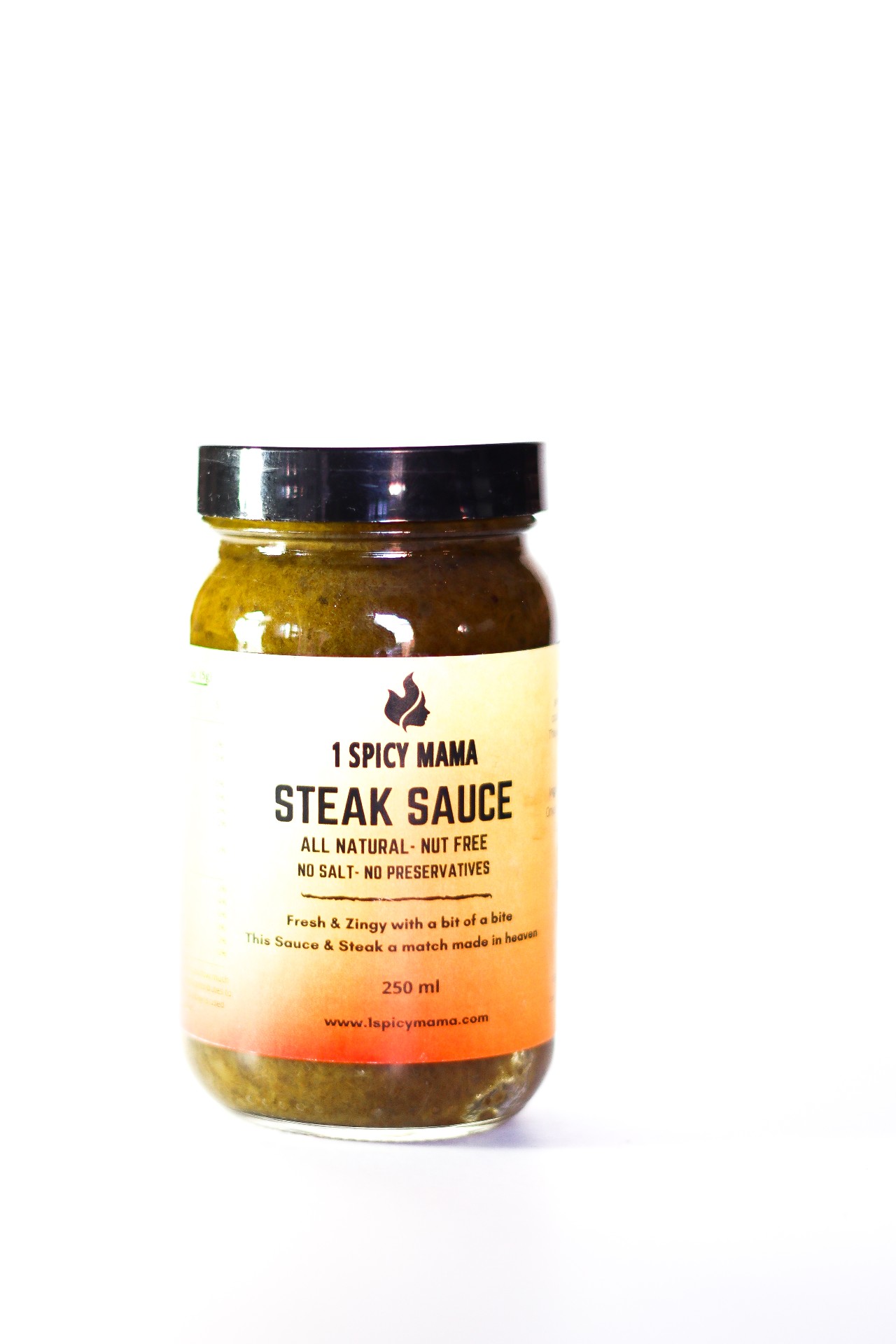 A bottle of fresh and zingy steak sauce with herbs and spices, perfect for enhancing steak dishes.