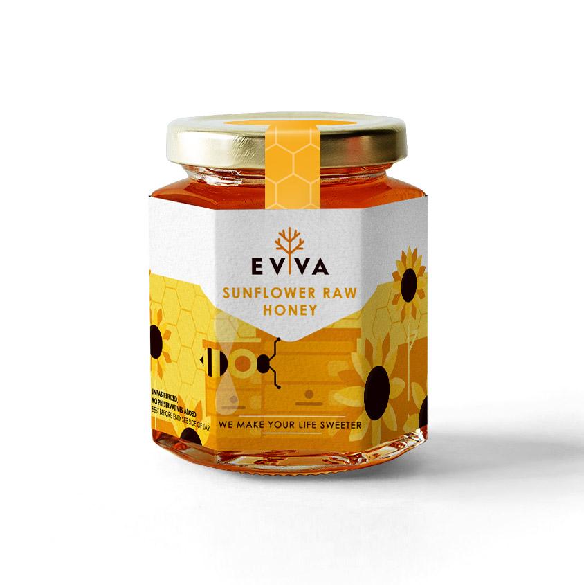 A jar of Sunflower Raw Honey showcasing its golden color and natural texture, surrounded by sunflowers.