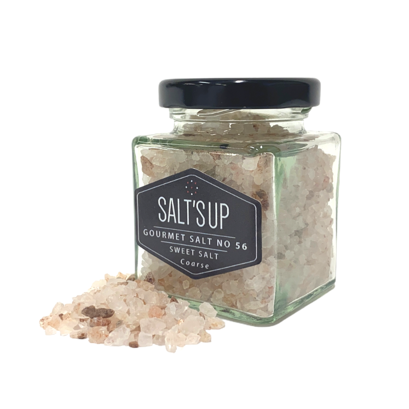 A jar of Sweet Salt coarse, a natural seasoning salt rich in minerals and iodine, perfect for enhancing flavors in various dishes.