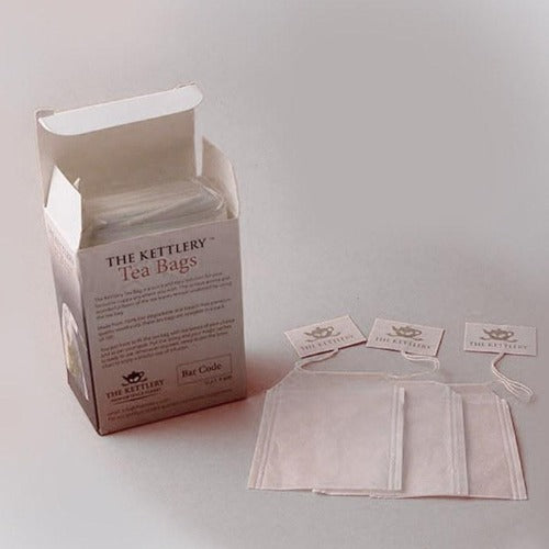 A pack of 100 Kettlery tea bags made from biodegradable wood pulp, ideal for loose leaf tea brewing.