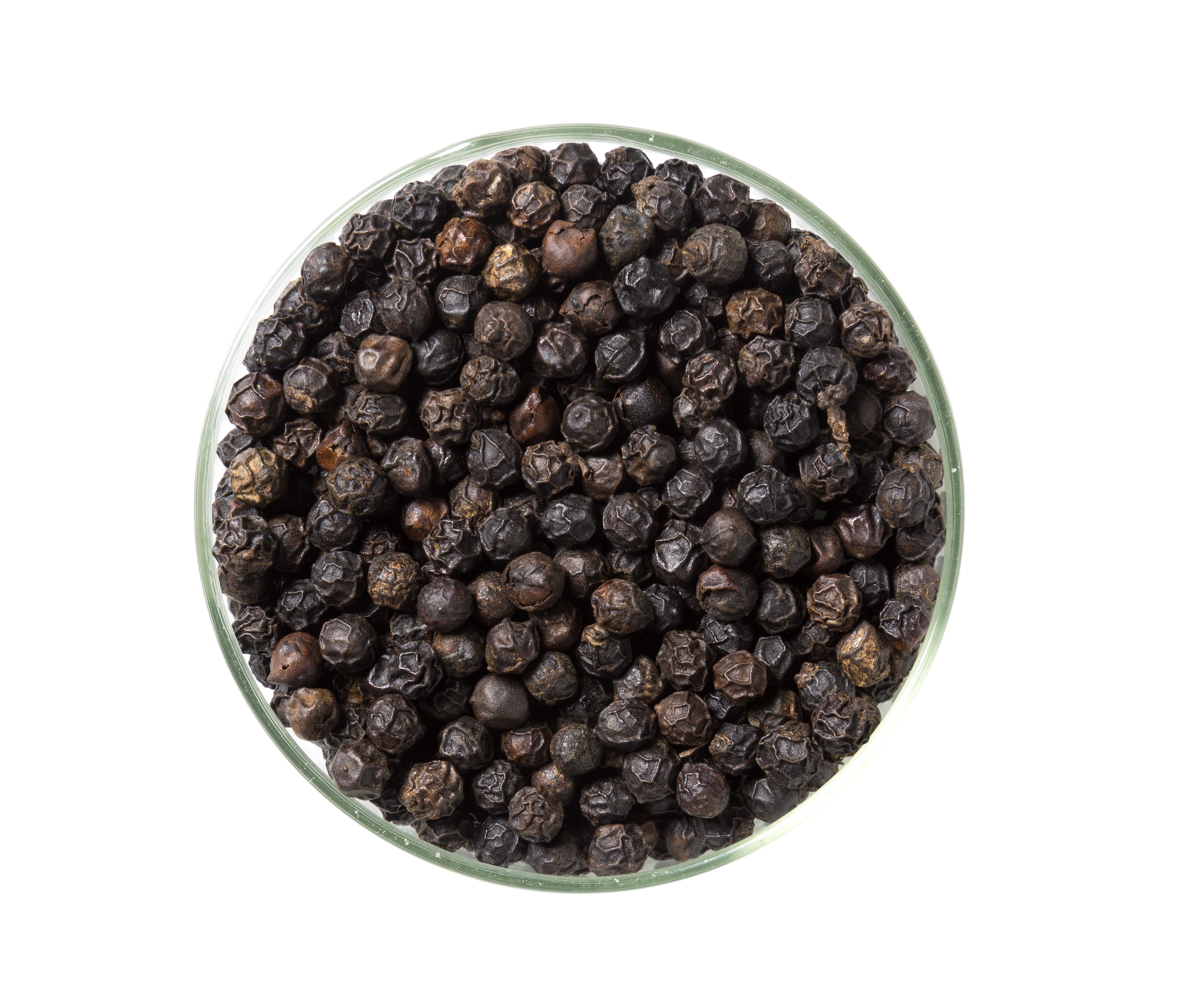 A glass jar containing high-quality Tellicherry peppercorns, showcasing their bold size and rich color.