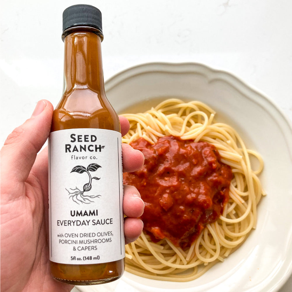 A collection of four unique sauces from Seed Ranch Flavor Co., showcasing Umami Everyday Sauce, Smoked Jalapeño, Thai Green, and Umami Reserve.