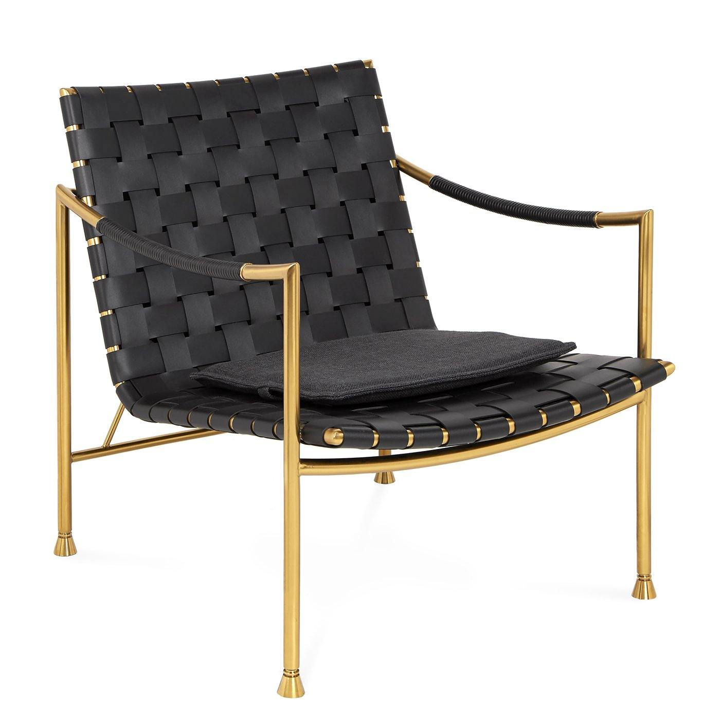 Thebes Lounge Chair featuring a brass frame, black leather seat, and removable cushion, showcasing modern elegance and comfort.