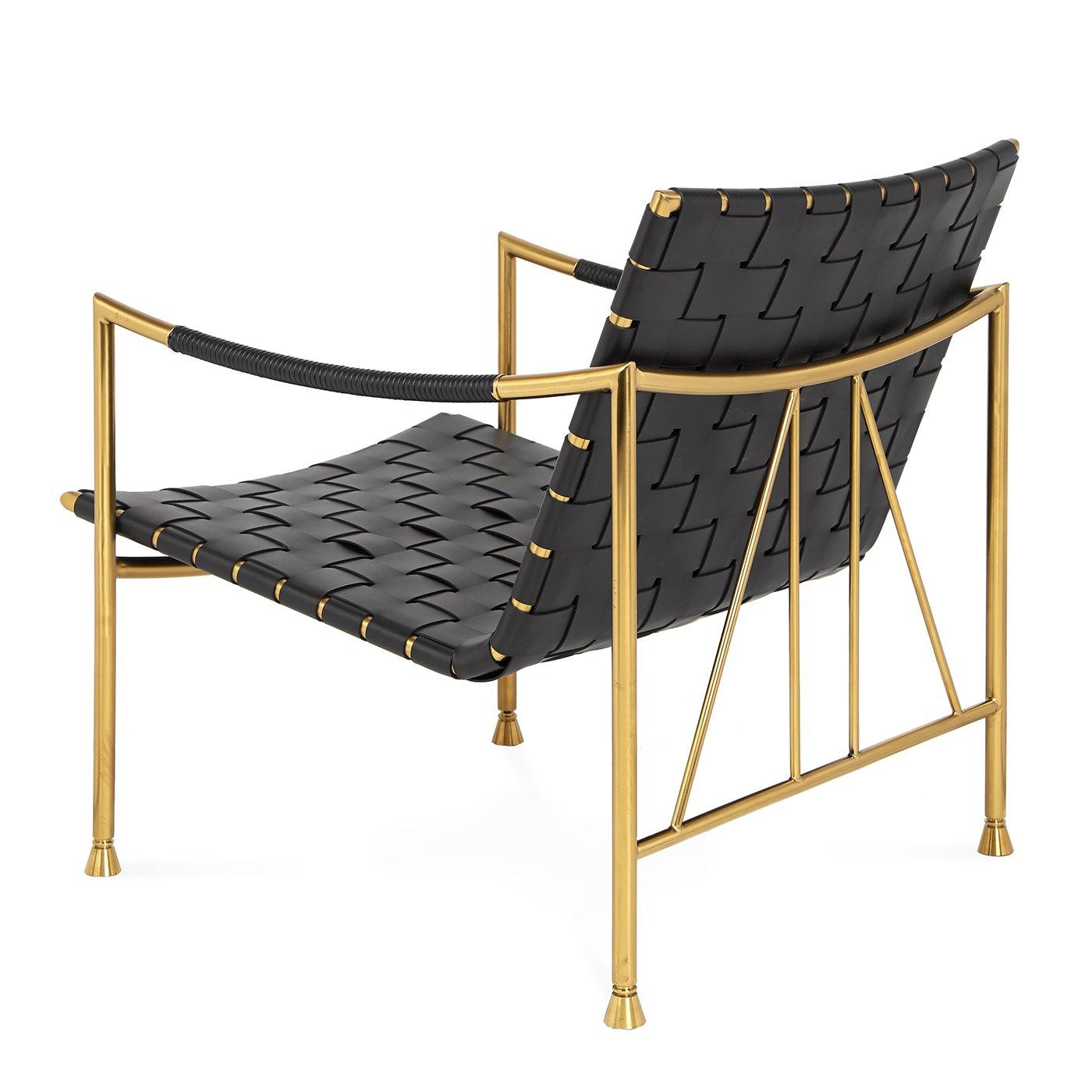 Thebes Lounge Chair featuring a brass frame, black leather seat, and removable cushion, showcasing modern elegance and comfort.