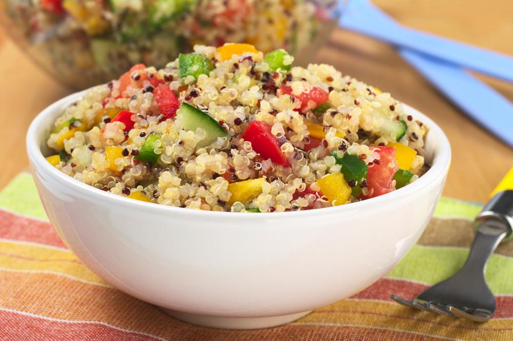 A jar of Three Color Quinoa showcasing a blend of black, white, and red quinoa grains, highlighting its nutritious and vibrant appearance.